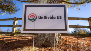 UnDivide US® Yard Sign - This patriotic yard sign is the perfect way to show everyone you believe in an undivided America, human rights, social justice, and civil rights.